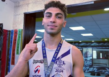 أمير العملة يخطف الأضواء بالكوفيه الفلسطينية فى بطولة العالم للمواي تاي